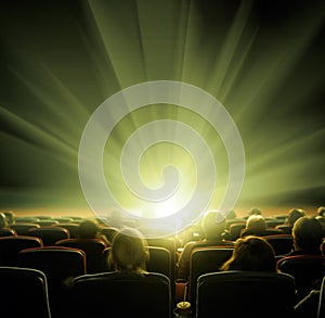 Viewers watch shining light in the cinema hall