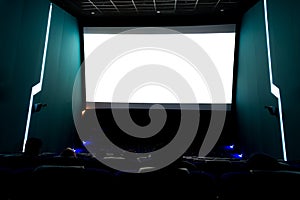 Viewers watching movie at cinema with screen isolated in white, long exposure