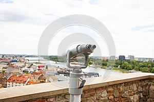 Viewing binoculars. Bratislava, Slovakia, panoramic view with castle on the old and new city. Travel, vacation, walking around the