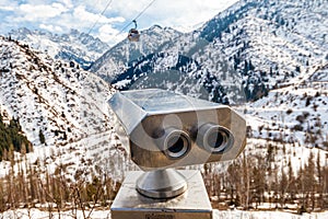 Viewing machine on the viewpoint on the top of the mountain, winter conditions