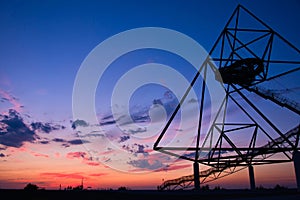 Viewing platform "Tetraeder" in Bottrop, Germany at sunset photo