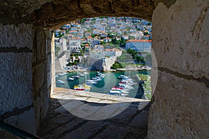 Viewing point in the Old City Wall looks out at small boats and houses point in the Old City Wall looks out at small boats and