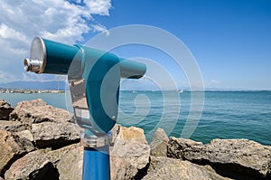 Viewing telescope monocular overlooking Lake Garda in Lombardy, Italy