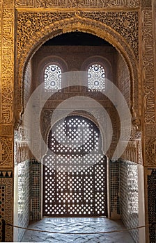 Viewing window with a wooden grille in the hall of ambassadors of the Alhambra in Granada, Spain.