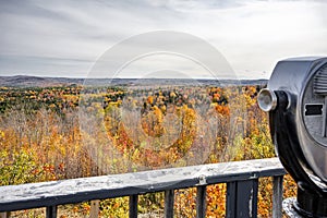 Viewpoint with Coin Binoculars with a Fabulous Landscape with Colorful Hills Covered with Autumn Maples in Vermont New England