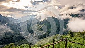 Viewpoint of fantastic mountain in fog with road