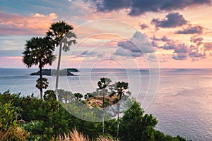 Viewpoint Laem Promthep cape with colorful sky and sugar palm tree in the sunset at Phuket