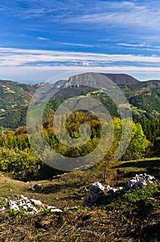 Viewpoint on a landscape of mount Bobija, peaks, hills, rocks, meadows and colorful forests