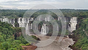 viewpoint overlooking the IguaÃ§u Falls. IguaÃ§u Falls is a set of about 275 waterfalls on the IguaÃ§u River.