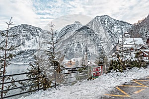 Viewpoint in snowy Hallstatt village with Quiet sign installed in winter time