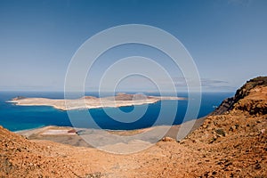 Viewpoint to La Graciosa from Lanzarote. Panorama of scenic view of La Graciosa Island and Atlantic ocean