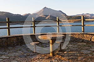 Viewpoint to a Reservoir with stone Table and Chairs photo