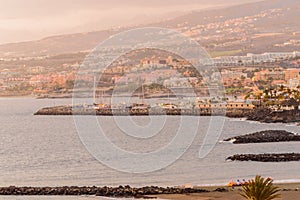 Views Of The Bay As Background The Marina In Playa De Las Americas. April 11, 2019. Santa Cruz De Tenerife Spain Africa. Travel