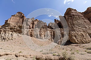 Views within the Charyn Canyon to the reddish sandstone cliffs. The canyon is also called valley of castles