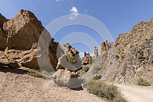Views within the Charyn Canyon to the reddish sandstone cliffs. The canyon is also called valley of castles