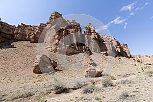 Views within the Charyn Canyon to the reddish sandstone cliffs. The canyon is also called valley of castles