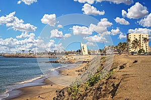 Views of the coastline of Dakar, Senegal, Africa. It is a beautiful long beach and in the background you can see buildings and