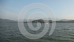 Views of islands from the sea near a beach palolem at sunset India Goa