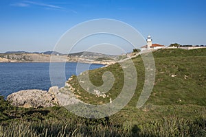 Views of the lighthouse of Punta del Torco de Afuera in Suances, Cantabria, Spain. photo