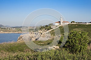 Views of the lighthouse of Punta del Torco de Afuera in Suances, Cantabria, Spain. photo