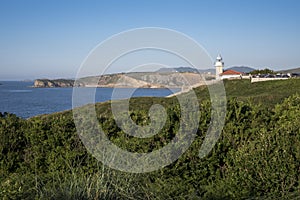 Views of the lighthouse of Punta del Torco de Afuera in Suances, Cantabria, Spain. photo