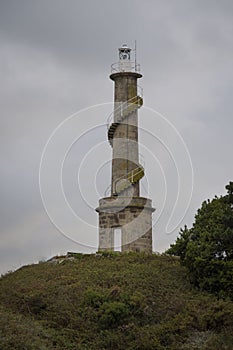 Views of the lighthouse of the Tambo island, from a boat, of the Ria de Pontevedra in Galicia, Spain photo