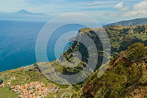 Views of Mount Teide, a village and a cliff from the glass interior of the Mirador de Abrante on the island of La Gomera. April 15