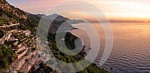 Views of the north coast of Mallorca with the Sierra de Tramuntana and the Mediterranean Sea near BaÃÂ±albufar at sunset photo