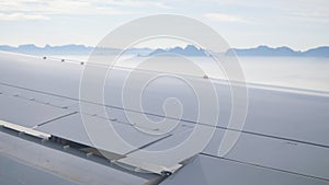 Views over the plane wing on the Table Mountains in South Africa from the Airplane.