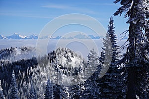 Views overlooking cloud-blanketed valley and Peaks Peeking above it at Whitefish Resort