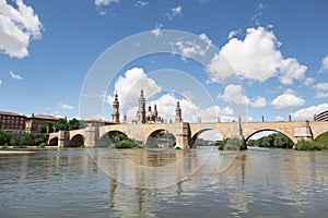 Views of the stone bridge and the basilica del Pilar next to the Ebro river in Zaragoza, Aragon, Spain