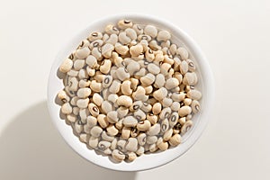 Black Eyed Pea legume. Top view of grains in a bowl. White background