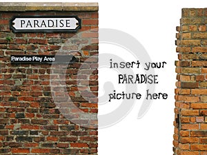 Vignette with paradise sign on old worn brick wall