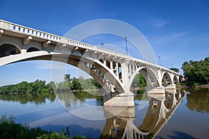 A white arched bridge over the Wabash River in Vincennes, Indiana. photo