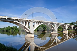 A white arched bridge over the Wabash River in Vincennes, Indiana. photo