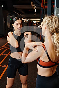 vigorous cheerful female coach helping her photo