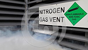 Vigorous discharge of dense white nitrogen gas fumes