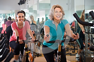 Vigorous females of different age training on exercise bikes