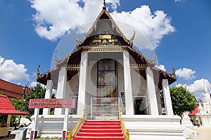 Viharn or monastic hall with large standing Buddha image at Wat Phra Mahathat Woramahawihan, Nakhon Si Thammarat, Thailand