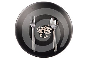 Viitamin pill on the balck dish