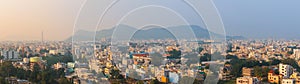 Vijayawada cityscape in India during twilight with tall buildings and colorful homes