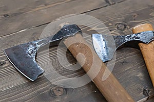 Viking battle ax close up on wooden background