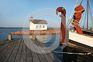 Viking boat and chapel in shipyard in Marienhamn