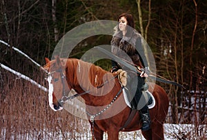 A Viking girl riding on horse painted in black runes. holds a bow and shoots it