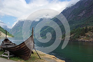 Viking ship on the shore of the fjord in Norway