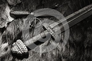 Viking sword and knife on a fur