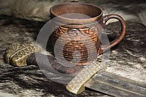 Viking sword and stein on a fur