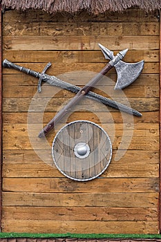 Viking weapons against the background of a wooden board