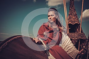 Viking woman with shield on Drakkar.