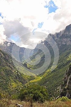 Vikos gorge valley on a partly cloudy day